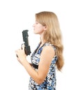 Shot of a beautiful girl holding gun over white Royalty Free Stock Photo