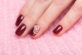 Shot beautiful manicure with flowers on female fingers. Nails design. Close-up Royalty Free Stock Photo