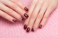 Shot beautiful manicure with flowers on female fingers. Nails design. Close-up Royalty Free Stock Photo
