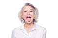 Shot of a beautiful mature woman having fun and teasing sticking out her tongue isolated on white background Royalty Free Stock Photo