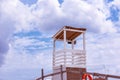 Shot of the beautiful tropical beach in a sunny day of summer, with a lifeguard place and boat parked on the seaside