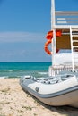 Shot of the beautiful tropical beach in a sunny day of summer, with a lifeguard place and boat parked on the seaside