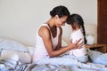 I see so much of myself in her. Shot of a beautiful young mother bonding with her little girl in bed at home. Royalty Free Stock Photo