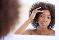 Beautiful skin can be yours. Shot of a beautiful young woman during her daily beauty routine. Royalty Free Stock Photo