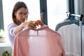 Beautiful young woman looking and choosing outfit at home wardrobe Royalty Free Stock Photo