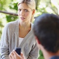 Are you kidding me. Shot of a beautiful young woman looking uncertain as her boyfriend is proposing. Royalty Free Stock Photo