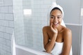 Shot of a beautiful young woman with a towel Royalty Free Stock Photo