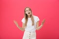 Shot of bored annoyed beautiful teenage girl with straight blond hair looking at camera with boring and annoying face Royalty Free Stock Photo