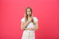 Shot of bored annoyed beautiful teenage girl with straight blond hair looking at camera with boring and annoying face Royalty Free Stock Photo