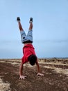 shot of a boy doing a handstand in the countryside. Royalty Free Stock Photo