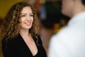 Shot of business woman smiling while talking with the man in front of her in brightness meeting room atmosphere , Concept success Royalty Free Stock Photo