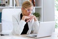 Business young woman working with her laptop in the office. Royalty Free Stock Photo