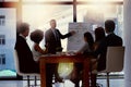 Leader his team to the success they seek. Shot of a businessman giving a presentation to his colleagues in an office. Royalty Free Stock Photo