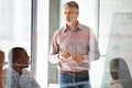 Good managers dont demand respect, they earn it. Shot of a businessman presenting his ideas to his colleagues during a Royalty Free Stock Photo