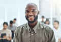 Ready to change the world. Shot of a businessman smiling at a business meeting in a modern office. Royalty Free Stock Photo