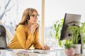 Shot of call center agent operator businesswoman working from home