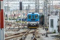 Shot capturing the front of a train with a view of multiple tracks seen in the surroundings