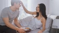 Shot of a Caring Young Man Bringing Tray with Breakfast in Bed to His Lovely Female Partner. Ideal Royalty Free Stock Photo