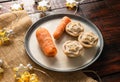 Shot of carrots and mince pies on a dish, festive star-shaped Christmas lights in the background