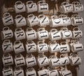 shot of ceramic mugs in a shop with black printd Alphabet letters on it for Name