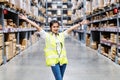 .Asian engineer woman showing hands coordination and raising fist smiling for successful working in workplace of industry Factory