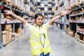 Asian engineer woman showing hands coordination and raising fist smiling for successful working in workplace of industry Factory