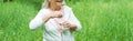 Shot of cheerful senior woman opening bottle with water in park Royalty Free Stock Photo