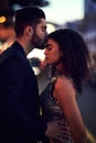 Special loving moments. Shot of a cheerful young couple holding one another while sharing a kiss on the forehead outside