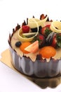 Shot chocolate cake topped with fresh fruit.