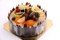 Shot chocolate cake topped with fresh fruit.