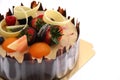 Shot chocolate cake topped with fresh fruit.