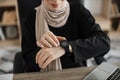 Shot of close-up view of female, putting her finger hand with smartwatch, measuring heartbeat pulse Royalty Free Stock Photo