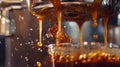 A shot of a coffee machine dripping rich dark coffee into a glass carafe