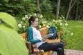 Shot of a college student reading a book in the park Royalty Free Stock Photo