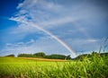 Rainbow over a green meadow Royalty Free Stock Photo