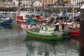 Shot of colorful fishing boats anchored at the port in Madrid, Spain