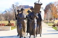 A shot of the copper statues at the Tennessee Woman`s Suffrage Monument surrounded by gorgeous autumn colored trees