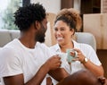 The prospect of going home is very appealing. Shot of a couple drinking coffee in their new home. Royalty Free Stock Photo