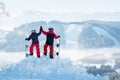 Snowboarders couple standing on top of the mountain Royalty Free Stock Photo