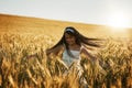 Shes Mother Natures favourite child. Shot of a cute little girl twirling in a cornfield. Royalty Free Stock Photo