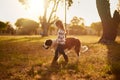 Where she goes, he goes. Shot of a cute little girl walking through a park with her dog. Royalty Free Stock Photo