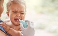 We have to unblock those passages. Shot of a doctor using a section tool to relieve a babys phlegm.