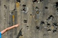 Shot down concrete fortification with a machine gun. bullet holes pointed by the hand of a little boy. marveles at the terrible ef Royalty Free Stock Photo