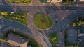 Aerial footage at sunset of traffic moving around a roundabout in Sheffield, South Yorkshire, UK