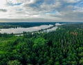 Shot from drone of green forest and river in Russia