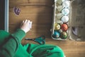 shot of an egg carton filled up with ornate eggshells, later to be used as Easter decorations