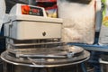 shot of an electric dough mixer machine with the measuring scale in the kitchen