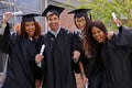 Ecstatic education success. Shot of excited university students on graduation day. Royalty Free Stock Photo