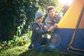 Camping is what childhood memories are made of. Shot of a father and his young son putting up their tent.