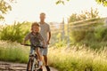 Father teaching his son how to ride a bicycle Royalty Free Stock Photo